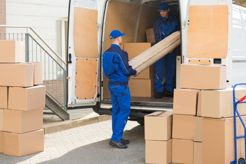 Removal van and moving crew in a Finsbury Park residential street