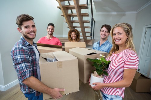 Packed moving boxes and furniture ready for house removals