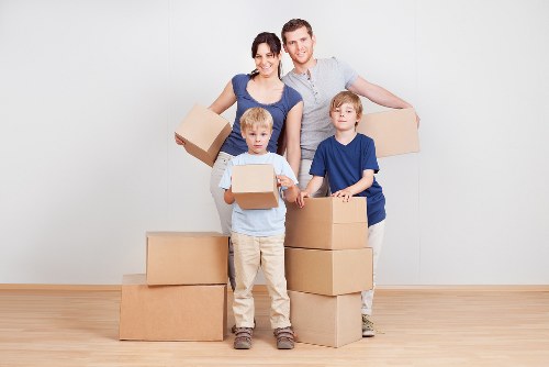 Loading household items into a van for transport in North London