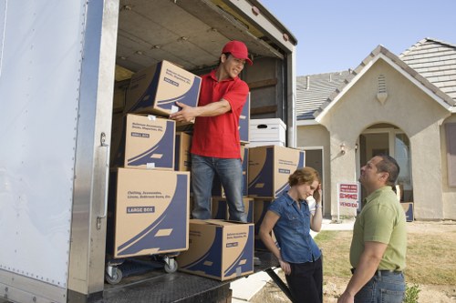 Careful wrapping and labelling of household items for relocation